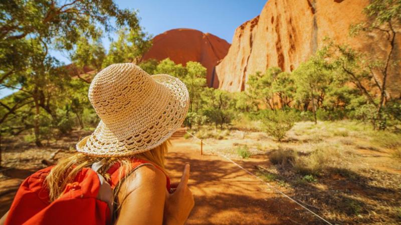 student standing looking at a desert view in the sunshine